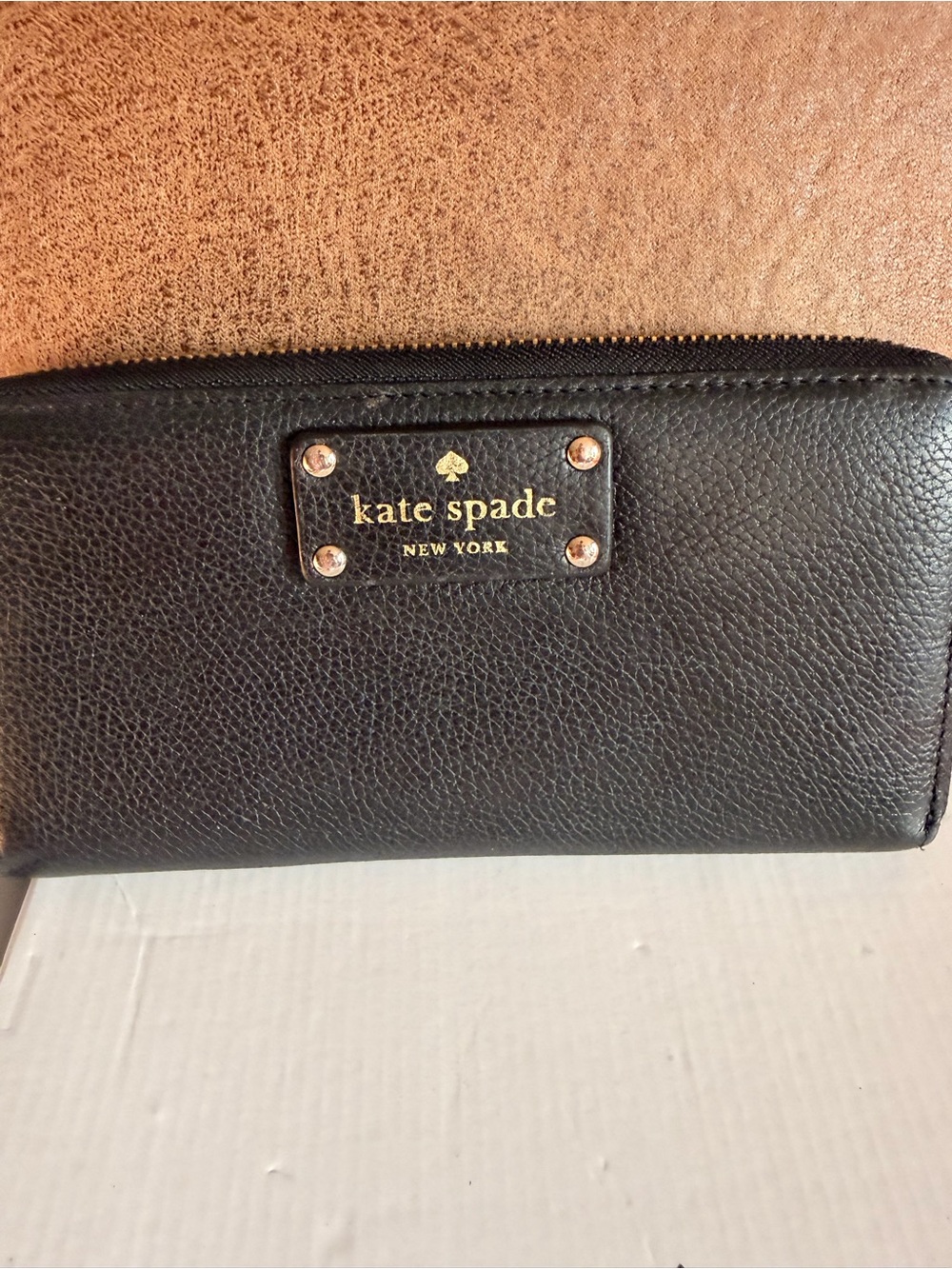kate spade Black Pebbled Leather Zip-Around Wallet with Gold Plaque